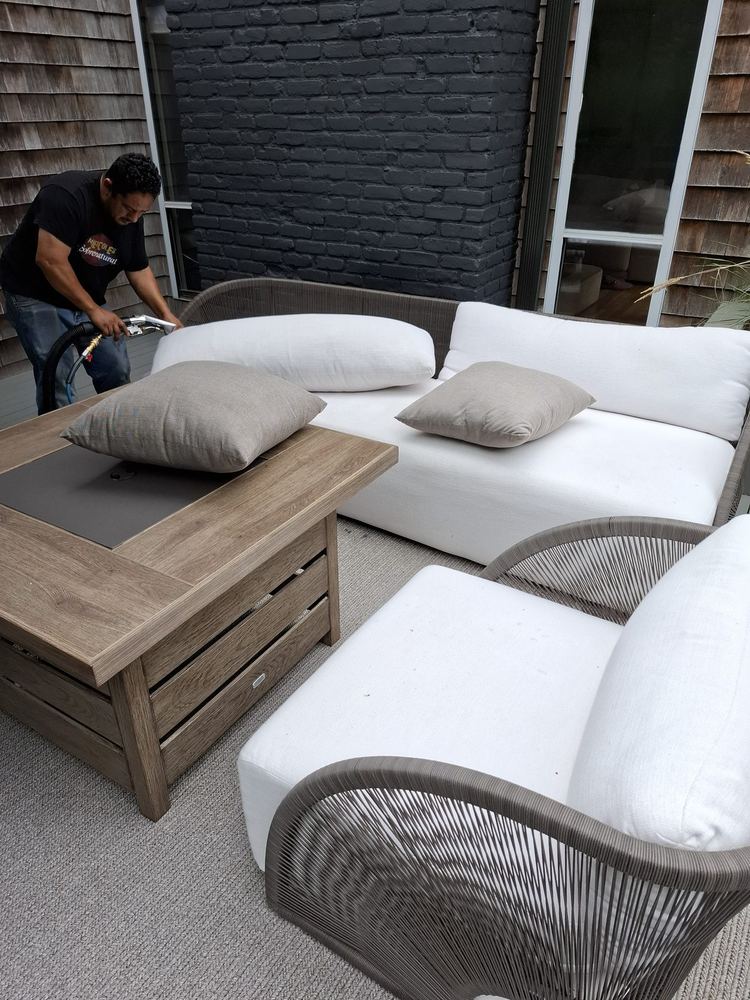 Sectional and rope accent chairs on a Long Island deck mid-clean